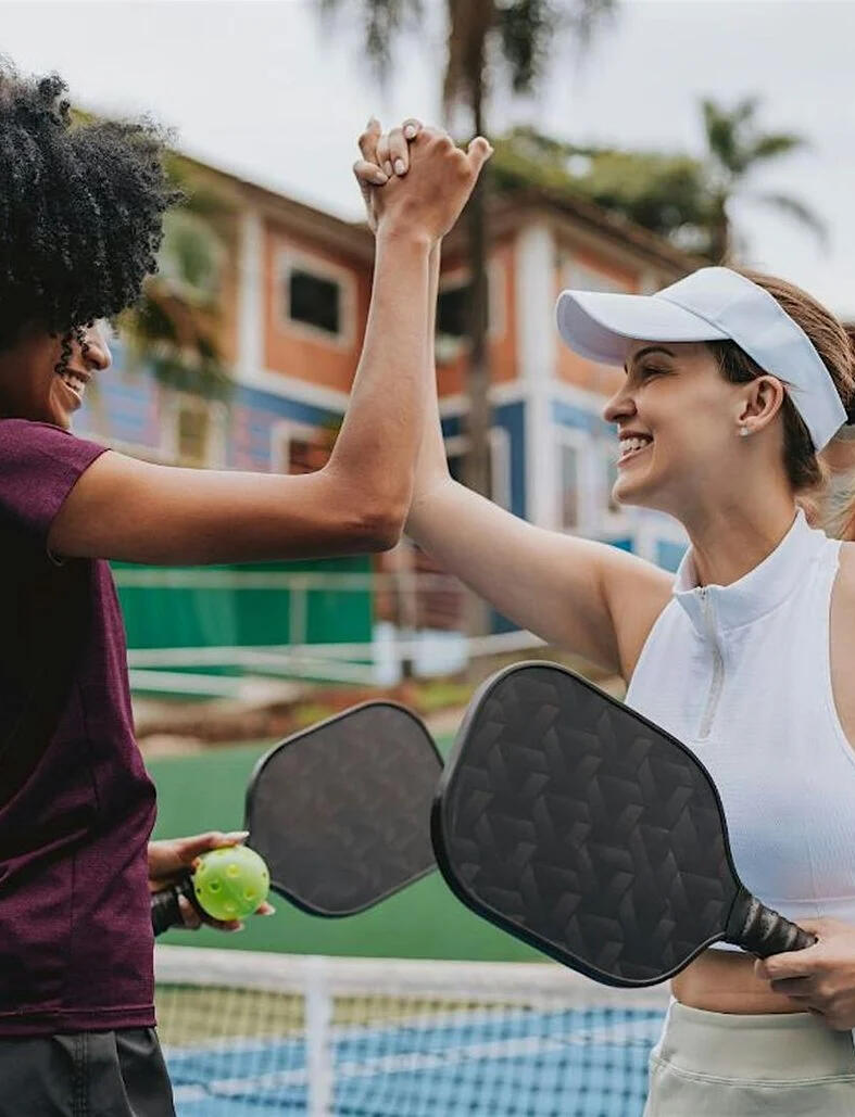 Founders Pickleball Club Saigon – Monday evening games and networking Group of founders in Saigon holding pickleball rackets, ready to play during the club’s Monday evening session